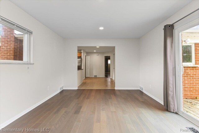 21142 Michael Ct, Saint Clair Shores, MI 48081 - empty room with hardwood / wood-style flooring and recessed lighting