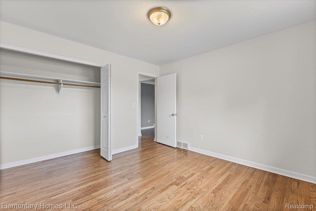 21142 Michael Ct, Saint Clair Shores, MI 48081 - unfurnished bedroom with a closet and light wood-style floors