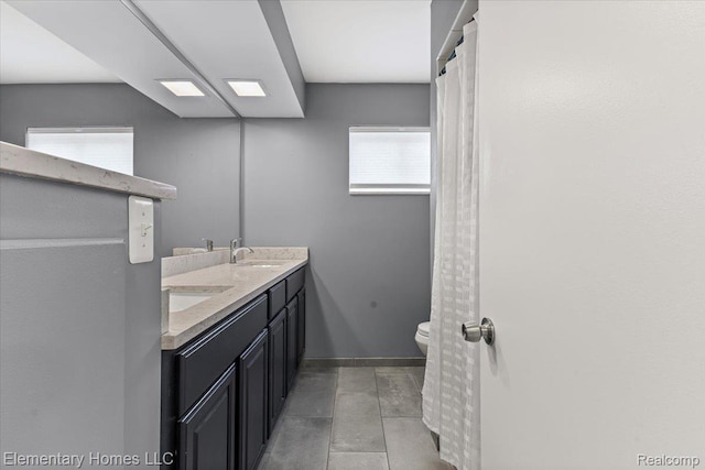 21142 Michael Ct, Saint Clair Shores, MI 48081 - bathroom featuring double vanity and tile patterned flooring
