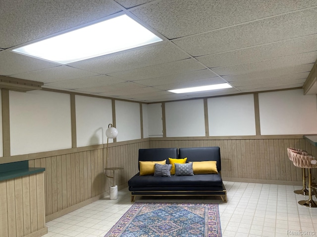 29494 Sylvan Ln Unit 6, Farmington Hills, MI 48334 - sitting room featuring a drop ceiling, tile patterned floors, and a decorative wall