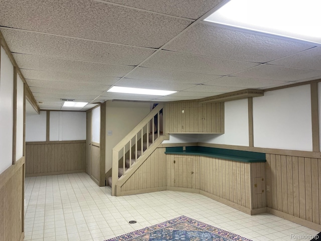 29494 Sylvan Ln Unit 6, Farmington Hills, MI 48334 - finished basement featuring wainscoting, stairs, a drop ceiling, and wood walls
