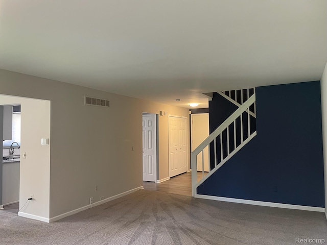 29494 Sylvan Ln Unit 6, Farmington Hills, MI 48334 - empty room with stairs and carpet floors