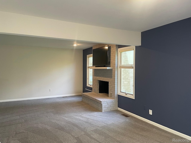 29494 Sylvan Ln Unit 6, Farmington Hills, MI 48334 - unfurnished living room featuring a fireplace and carpet flooring