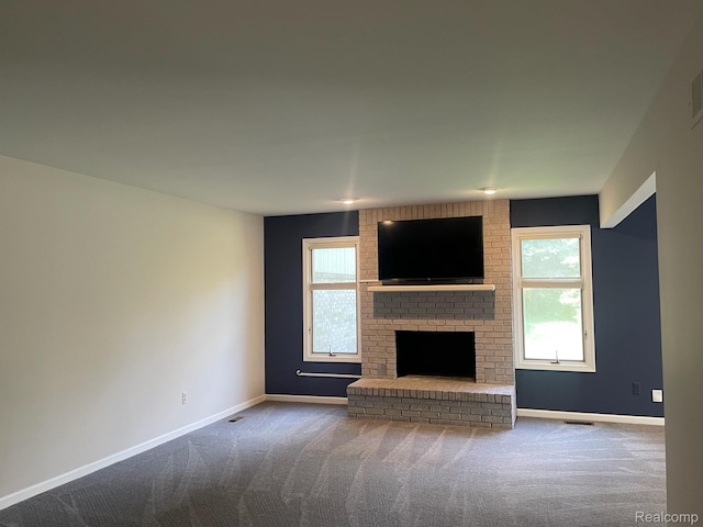 29494 Sylvan Ln Unit 6, Farmington Hills, MI 48334 - unfurnished living room with carpet flooring, healthy amount of natural light, and a fireplace