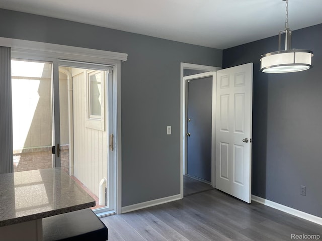 29494 Sylvan Ln Unit 6, Farmington Hills, MI 48334 - unfurnished dining area featuring plenty of natural light and wood finished floors