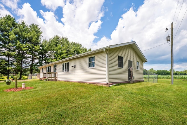 28644 Elm St, Dowagiac, MI 49047 - back of property featuring a yard and a wooden deck