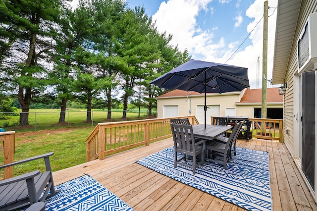 28644 Elm St, Dowagiac, MI 49047 - wooden deck with outdoor dining area, a fenced backyard, and an outdoor structure