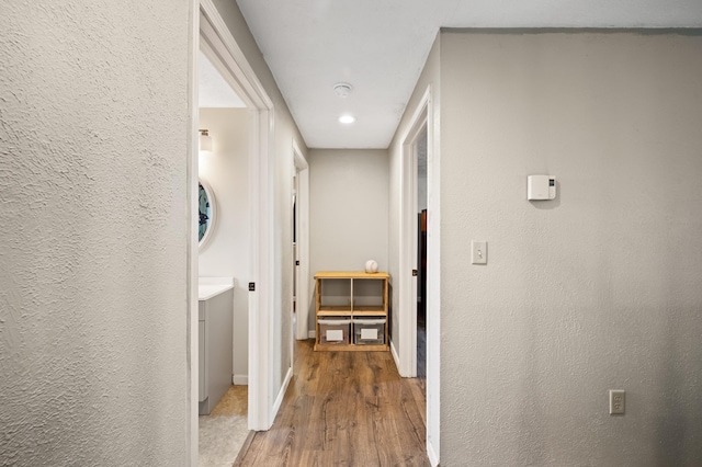 28644 Elm St, Dowagiac, MI 49047 - hall with wood finished floors, a textured wall, and recessed lighting