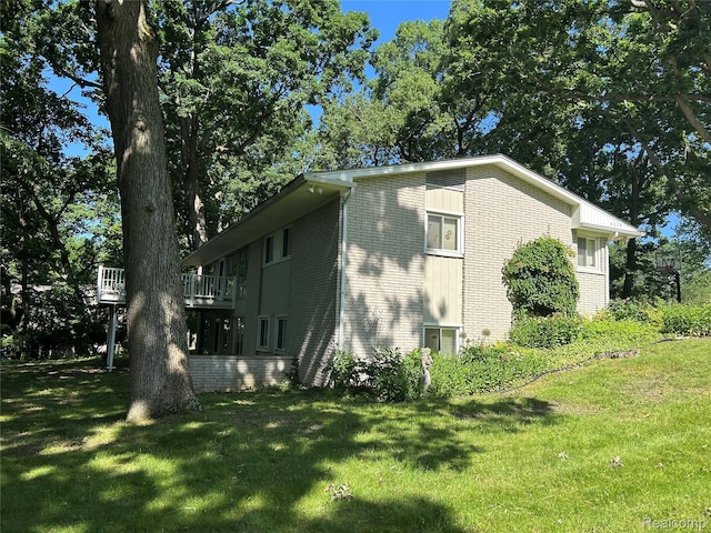 4230 Wendell Rd, West Bloomfield, MI 48323 - view of side of property with brick siding and a yard