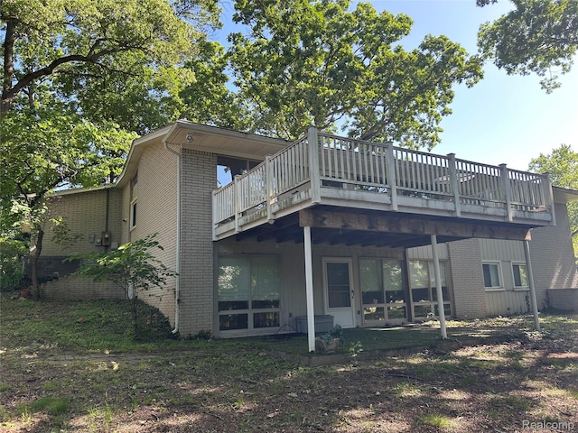 4230 Wendell Rd, West Bloomfield, MI 48323 - rear view of house featuring brick siding and a deck