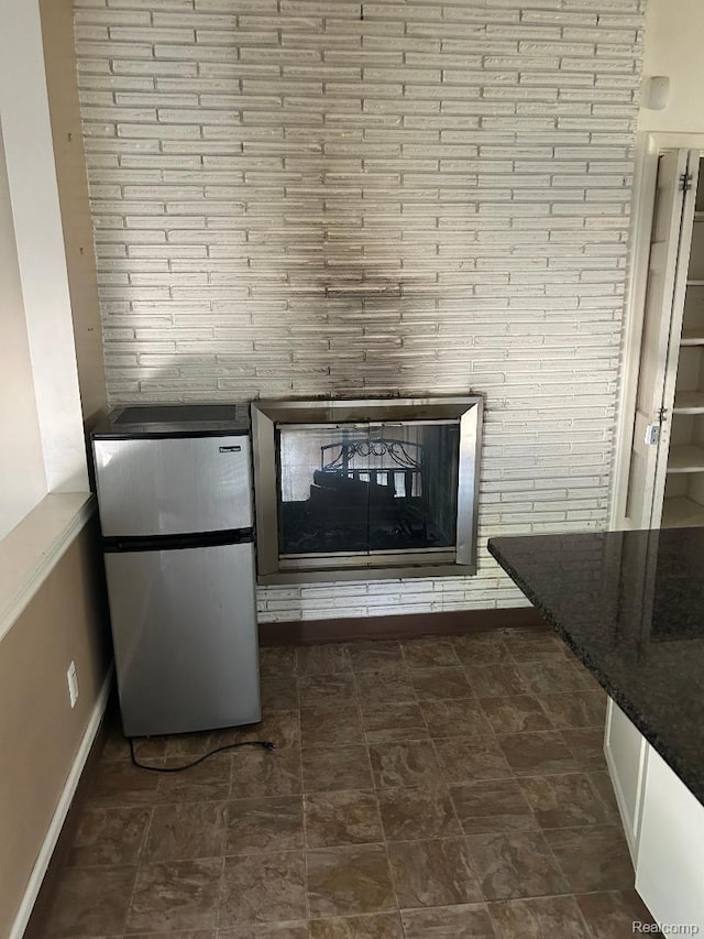 4230 Wendell Rd, West Bloomfield, MI 48323 - detailed view of freestanding refrigerator and baseboards