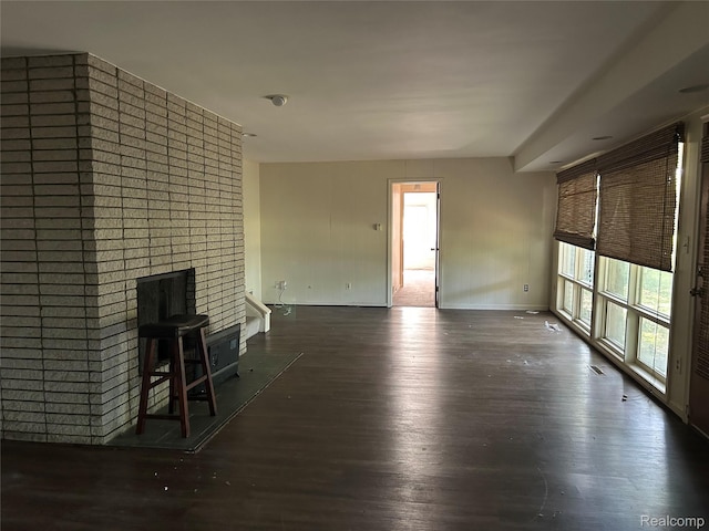 4230 Wendell Rd, West Bloomfield, MI 48323 - unfurnished living room with a fireplace and wood finished floors