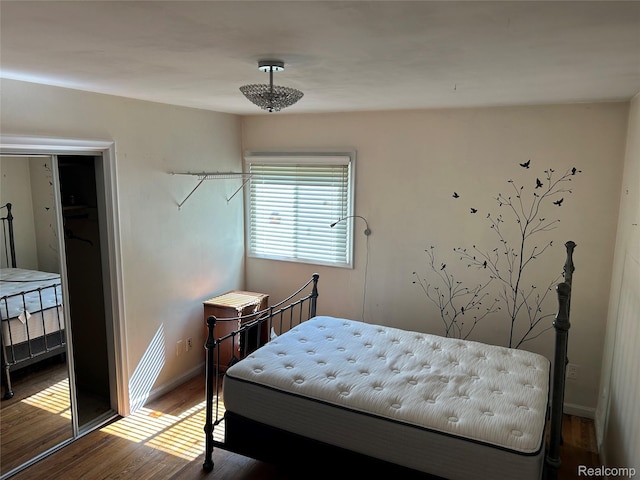 4230 Wendell Rd, West Bloomfield, MI 48323 - bedroom featuring wood finished floors and baseboards