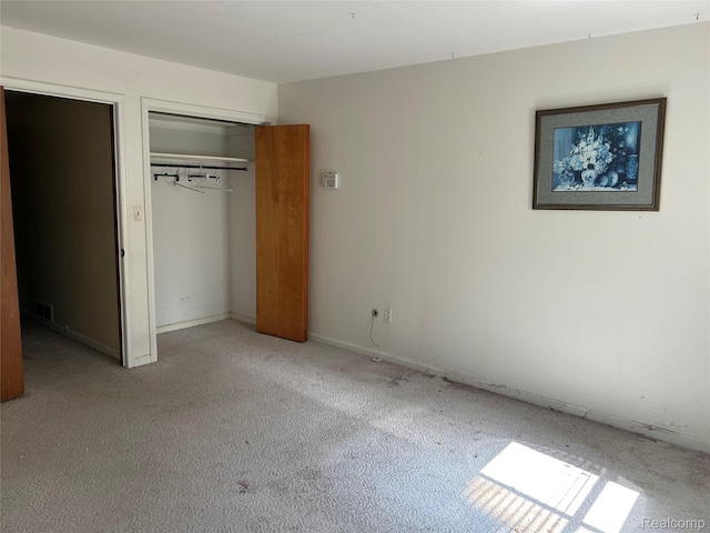 4230 Wendell Rd, West Bloomfield, MI 48323 - unfurnished bedroom featuring light colored carpet and a closet