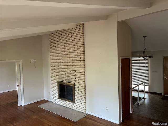 4230 Wendell Rd, West Bloomfield, MI 48323 - unfurnished living room featuring wood finished floors, beamed ceiling, a brick fireplace, high vaulted ceiling, and a chandelier
