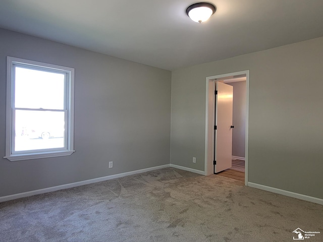 2844 1st St, Monroe, MI 48162 - carpeted empty room with baseboards