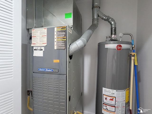 2844 1st St, Monroe, MI 48162 - utility room featuring gas water heater and heating unit