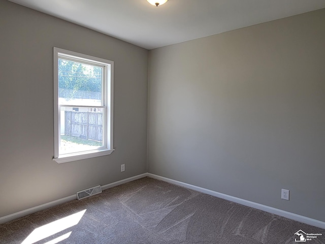 2844 1st St, Monroe, MI 48162 - carpeted empty room featuring baseboards