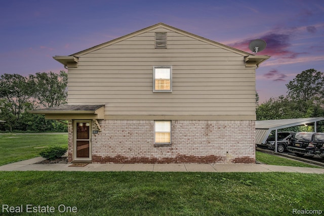 204 Princeton Dr, South Lyon, MI 48178 - view of side of property with a lawn, brick siding, and a carport