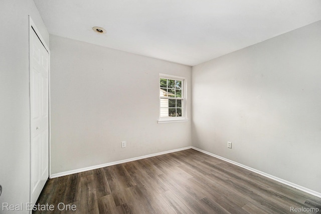 204 Princeton Dr, South Lyon, MI 48178 - unfurnished bedroom featuring wood finished floors and a closet