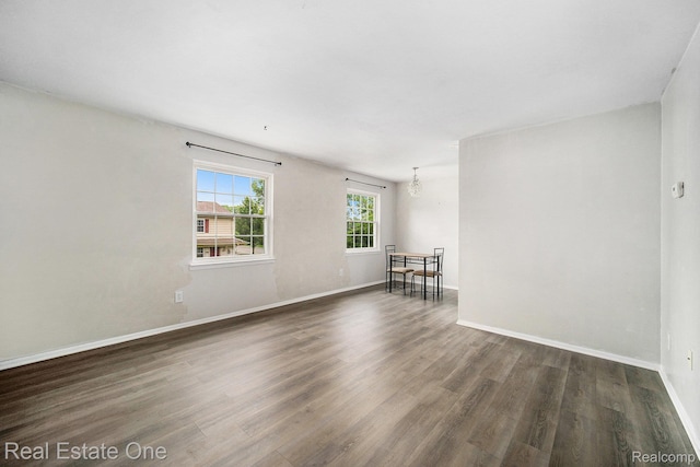 204 Princeton Dr, South Lyon, MI 48178 - spare room with dark wood-type flooring and baseboards