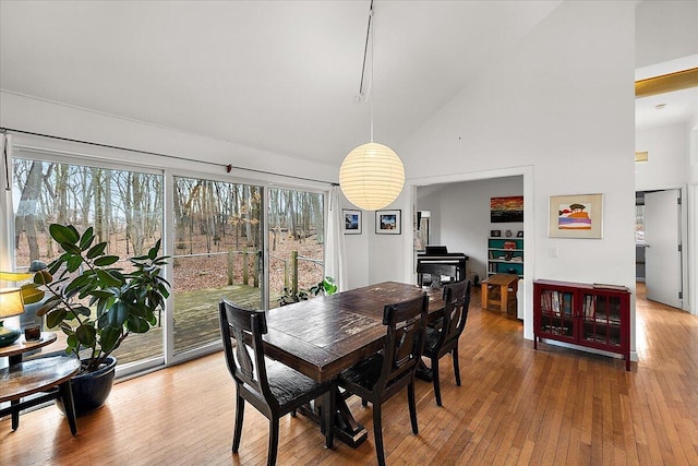 7227 Wheeler Rd, Whitmore Lake, MI 48189 - dining room with wood-type flooring and high vaulted ceiling