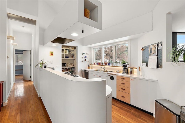 7227 Wheeler Rd, Whitmore Lake, MI 48189 - kitchen with dishwasher, wood-type flooring, healthy amount of natural light, light countertops, and a towering ceiling