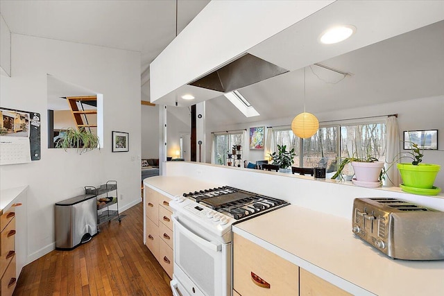 7227 Wheeler Rd, Whitmore Lake, MI 48189 - kitchen with white gas range, dark wood-style flooring, decorative light fixtures, and light countertops