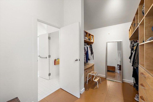7227 Wheeler Rd, Whitmore Lake, MI 48189 - spacious closet featuring light tile patterned floors