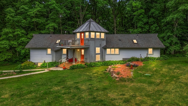 7227 Wheeler Rd, Whitmore Lake, MI 48189 - contemporary home featuring a front yard, a view of trees, and a balcony