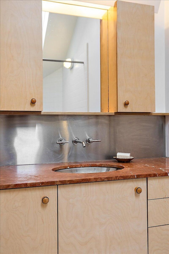 7227 Wheeler Rd, Whitmore Lake, MI 48189 - bathroom with vanity and decorative backsplash