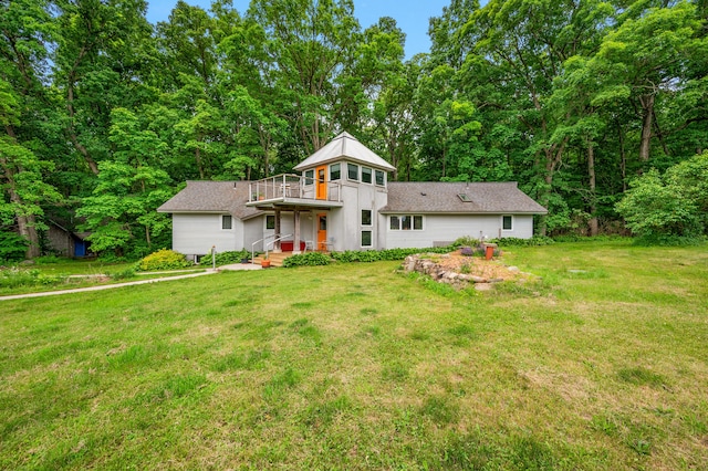7227 Wheeler Rd, Whitmore Lake, MI 48189 - view of front of house with a front yard and a balcony