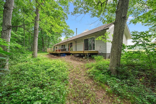 7227 Wheeler Rd, Whitmore Lake, MI 48189 - back of property featuring a deck