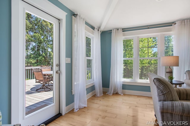 8608 Woodruff Dr SW, Byron Center, MI 49315 - doorway featuring wood finished floors and beam ceiling