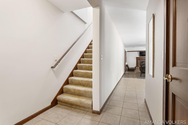 8608 Woodruff Dr SW, Byron Center, MI 49315 - stairs with tile patterned flooring and baseboards