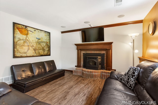8608 Woodruff Dr SW, Byron Center, MI 49315 - living area featuring wood finished floors, ornamental molding, and a brick fireplace