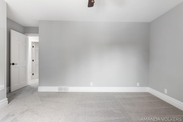 8608 Woodruff Dr SW, Byron Center, MI 49315 - carpeted empty room with baseboards and a ceiling fan