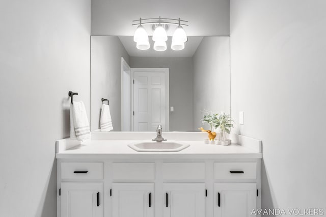 8608 Woodruff Dr SW, Byron Center, MI 49315 - bathroom with vanity and a chandelier