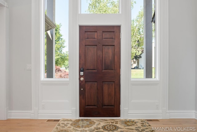 8608 Woodruff Dr SW, Byron Center, MI 49315 - entrance foyer featuring wood finished floors and healthy amount of natural light