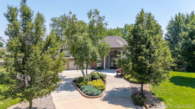 8608 Woodruff Dr SW, Byron Center, MI 49315 - obstructed view of property featuring driveway and a front lawn