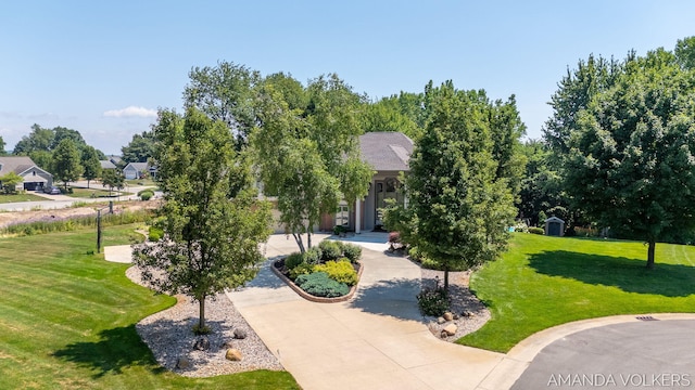 8608 Woodruff Dr SW, Byron Center, MI 49315 - view of property's community with a lawn and curved driveway