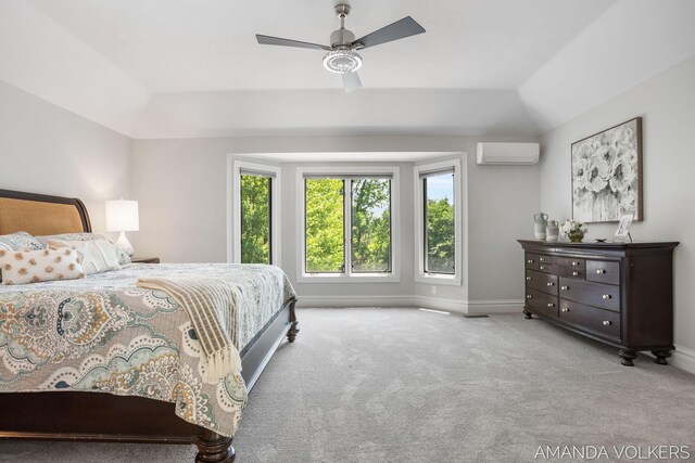 8608 Woodruff Dr SW, Byron Center, MI 49315 - carpeted bedroom with an AC wall unit, lofted ceiling, and a ceiling fan