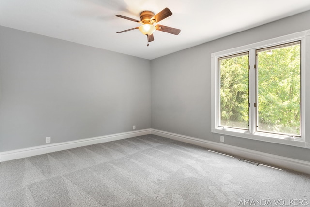 8608 Woodruff Dr SW, Byron Center, MI 49315 - spare room featuring a ceiling fan and carpet floors