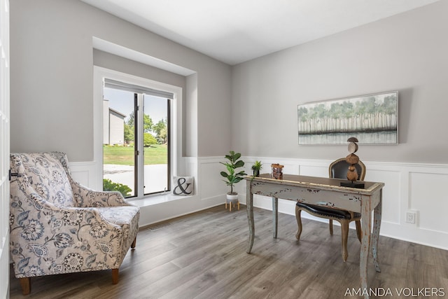 8608 Woodruff Dr SW, Byron Center, MI 49315 - office with a wainscoted wall, wood finished floors, and a decorative wall