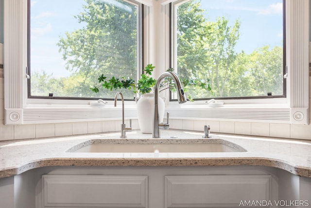 8608 Woodruff Dr SW, Byron Center, MI 49315 - kitchen view of white cabinets and light stone counters