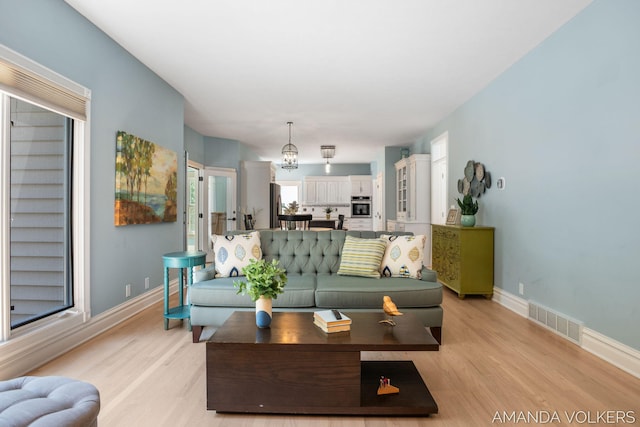 8608 Woodruff Dr SW, Byron Center, MI 49315 - living area with light wood-type flooring