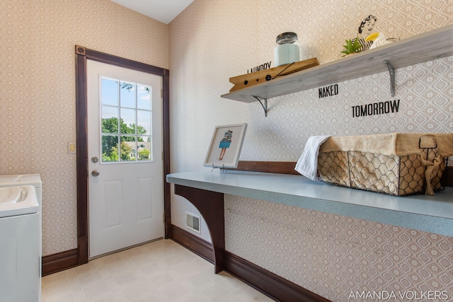 8608 Woodruff Dr SW, Byron Center, MI 49315 - laundry area featuring wallpapered walls, washer and dryer, and light flooring