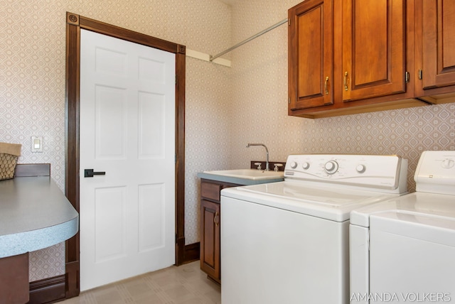 8608 Woodruff Dr SW, Byron Center, MI 49315 - laundry area featuring cabinet space, independent washer and dryer, wallpapered walls, and light flooring