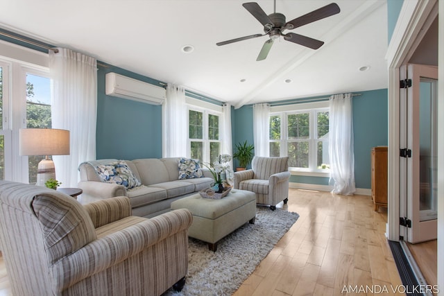 8608 Woodruff Dr SW, Byron Center, MI 49315 - living area with a wall unit AC, light wood finished floors, lofted ceiling, a ceiling fan, and recessed lighting