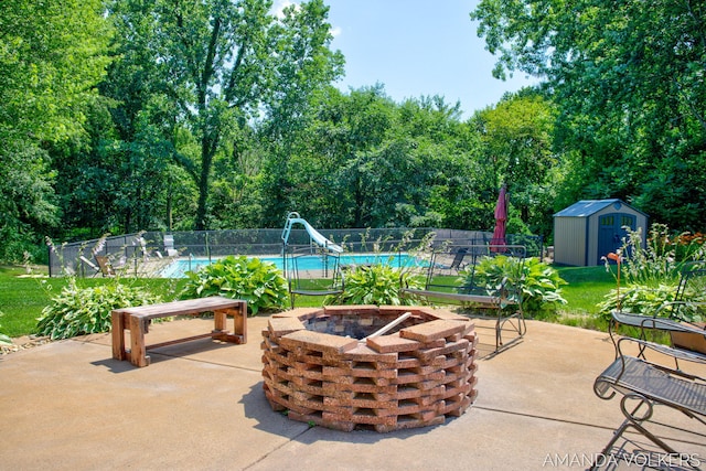 8608 Woodruff Dr SW, Byron Center, MI 49315 - view of patio with a fire pit and a storage shed